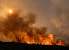 Wildfire on top of hill.